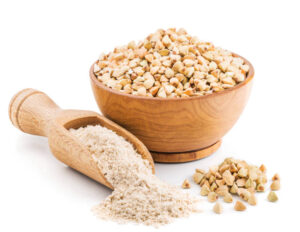 Whole grain buckwheat flour isolated on white background